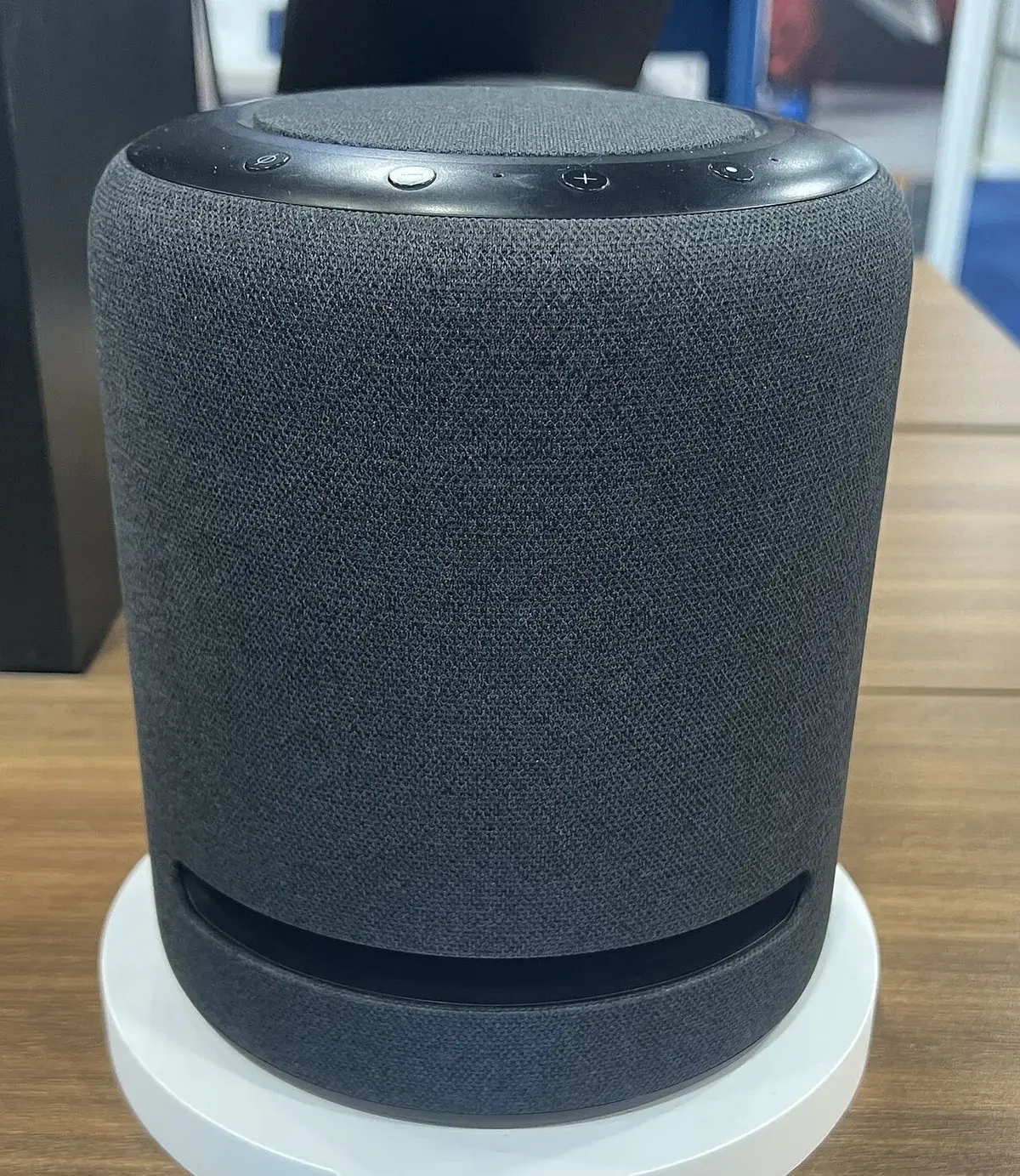 Close-up of an Amazon Echo Studio smart speaker on a table.