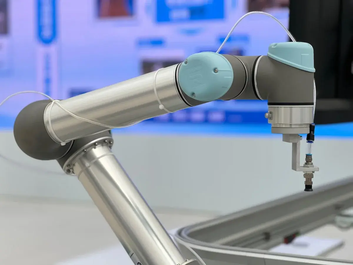 Close-up of an industrial robot arm in a factory setting.