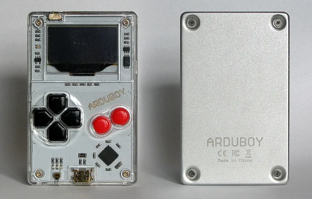 Front and back view of an Arduboy handheld game console.
