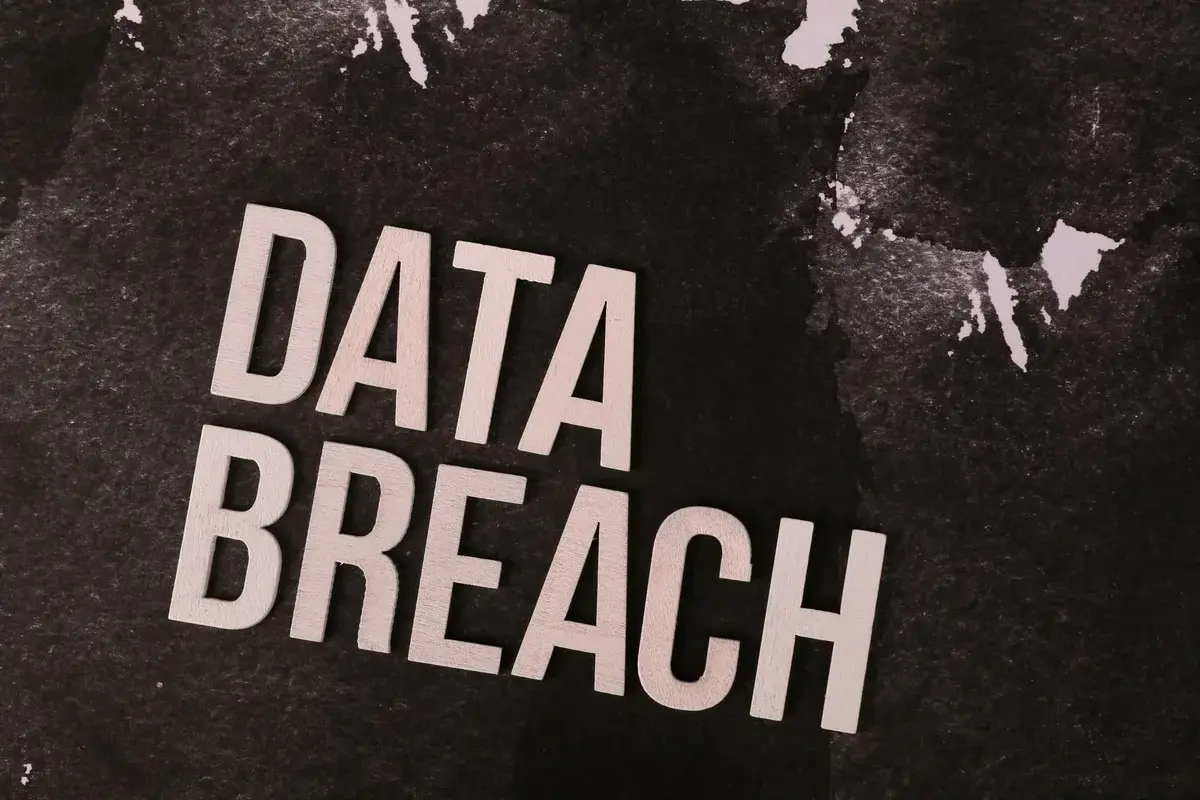 The words "DATA BREACH" on a dark textured background.