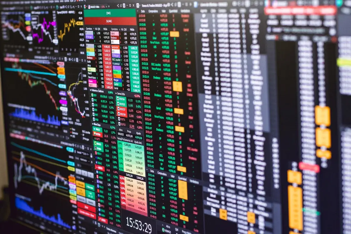 A computer screen displaying stock charts and market data.