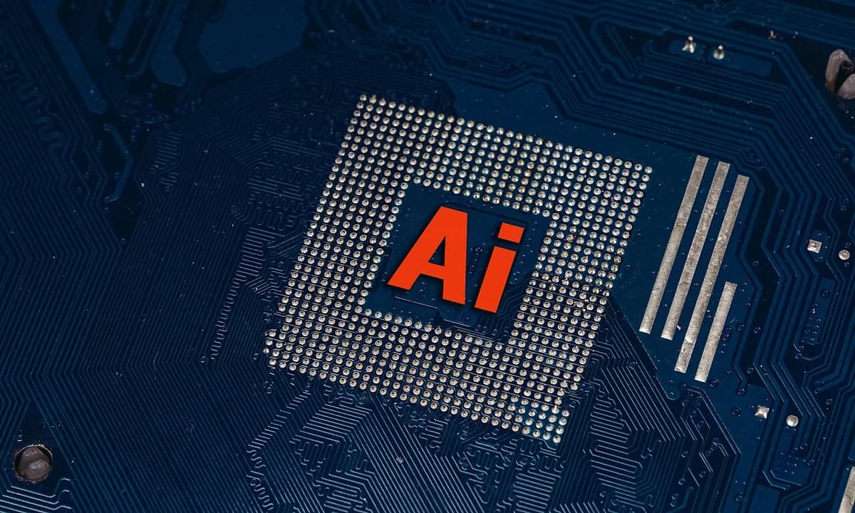 Close-up of a circuit board with "AI" on a processor chip.