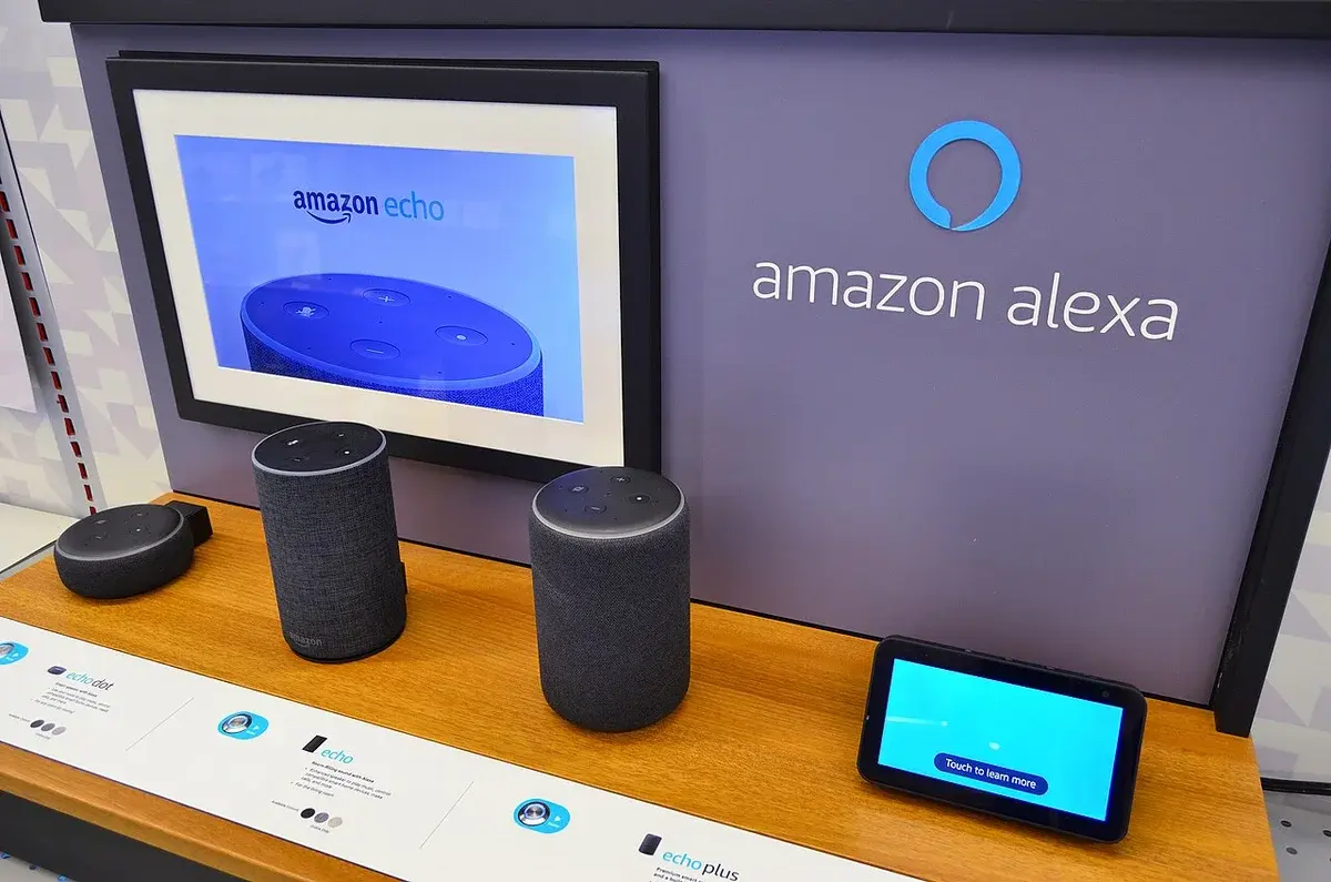 Amazon Alexa promotional booth with Echo devices on display.