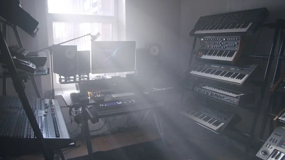 A music recording studio lit by soft morning sunlight.