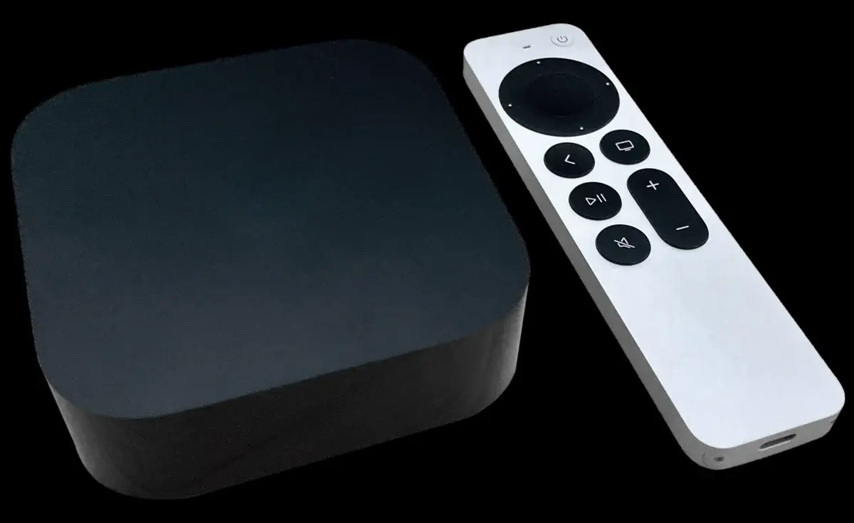 Apple TV 4K box with remote on a black background