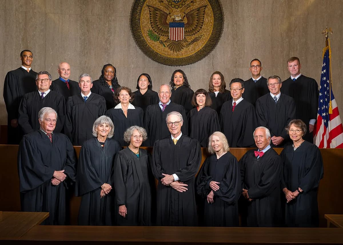 Group portrait of federal judges in a courtroom.