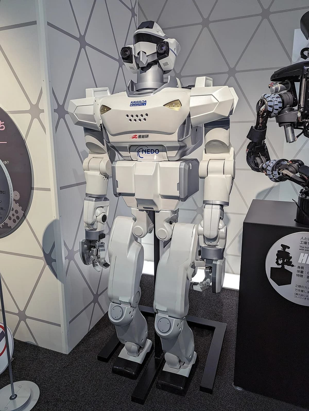 A humanoid robot on display in a museum exhibit.